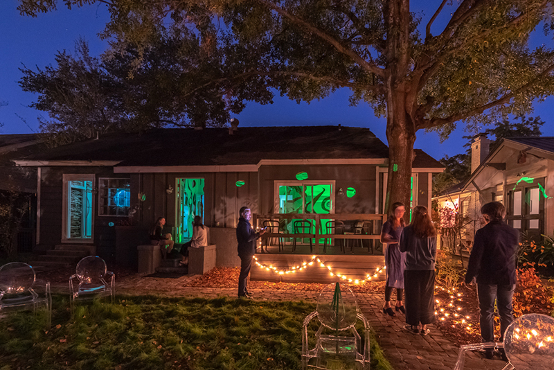 Screen on column in lobby showing water flowing over rocks